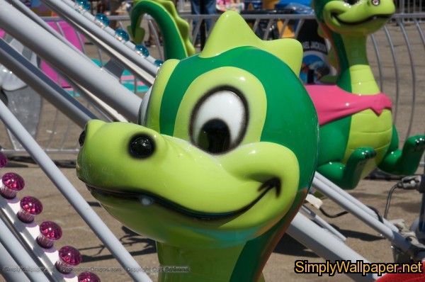cartoon like dragon head on an amusement park ride