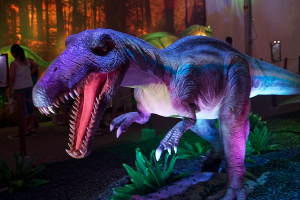 carnivorous dinosaur walking on two legs, sharp claws and teeth