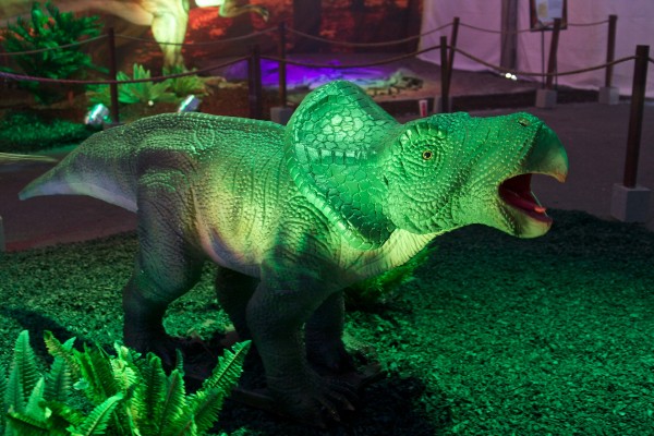green herbivore dinosaur with parrot like beak and head crest