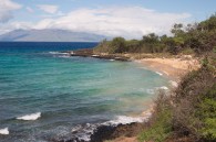small beach with view of western Maui in the distance