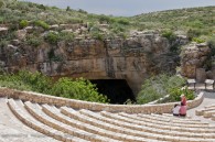 outdoor amphitheater overlooking cave entrance