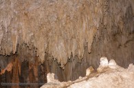 cave chamber full of stalactites and stalagmites