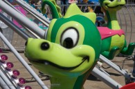 cartoon like dragon head on an amusement park ride