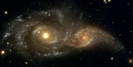 hubble telescope image of two massive galaxies colliding in space