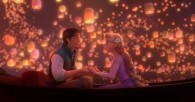 Flynn and Rapunzel in a boat with lanterns overhead from Disney's animated movie Tangled
