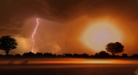 lightning strikes and flashes over the African savanna wallpaper