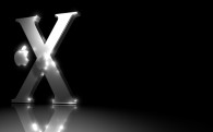 Apple Mac OS X logo with a metallic finish on a black background